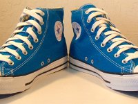 Cyan Space High Top Chucks  Angled front view of cyan space high tops.